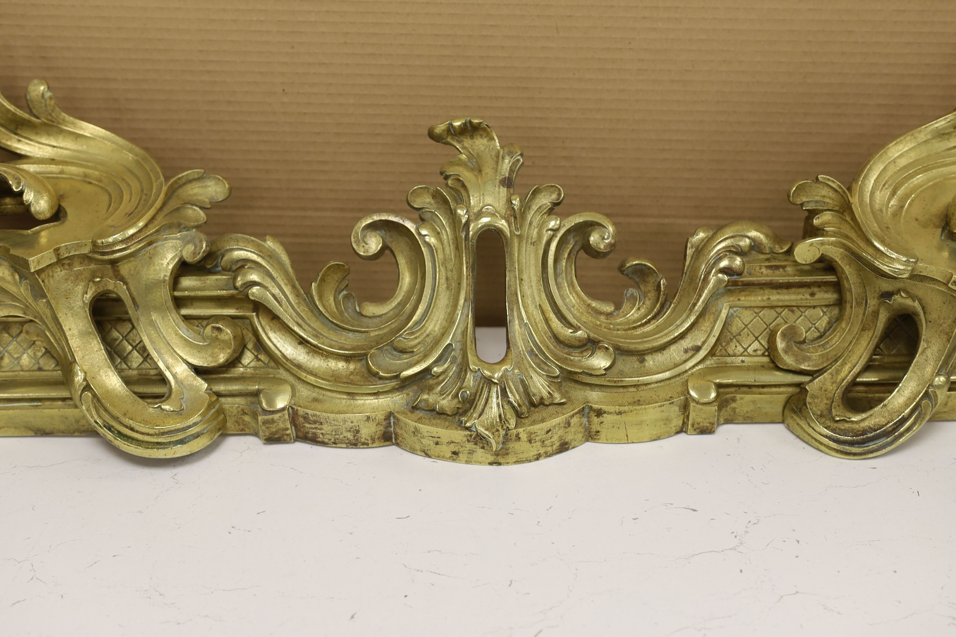 A French rococo style bronze adjustable chenet